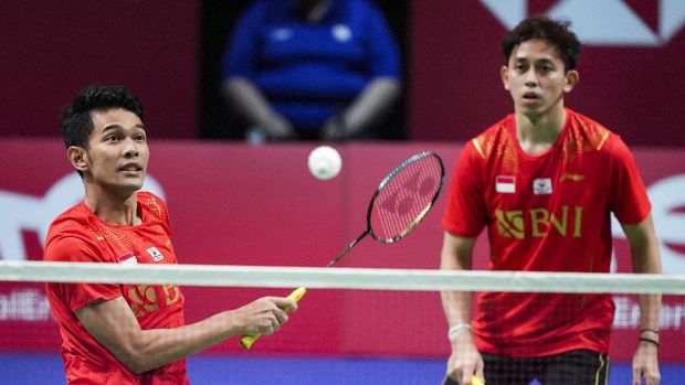 Indonesia's Fajar Alfian, left, and Muhammas Rian Ardianto in action during a men's double match in the Thomas Cup men's team final badminton match between China and Indonesia, in Aarhus, Denmark, Sunday Oct. 17, 2021. (Claus Fisker/Ritzau Scanpix via AP)